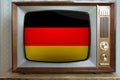 Old tube vintage TV with the national flag of Germany on the screen, the concept of eternal values Ã¢â¬â¹Ã¢â¬â¹on television, global